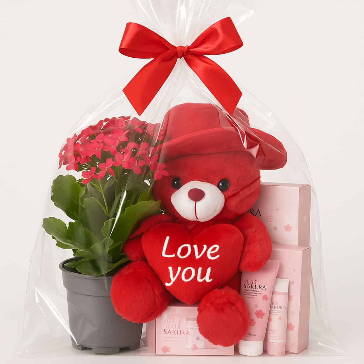 Cadou Perfect pentru Ea 1 Posibilă descriere: Cadou Valentine's Day cu urs, coș cu plante și produse cosmetice Sakura pentru îngrijire și frumusețe.