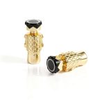 Auricolare de parfum aurie, elegant și sofisticat, pentru un stil în trend și lux.